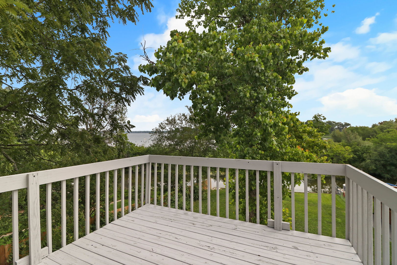 39 Rushmore Road Fox Lake, IL 60020 - Photo 18 of 38 a balcony with wooden floor and fence