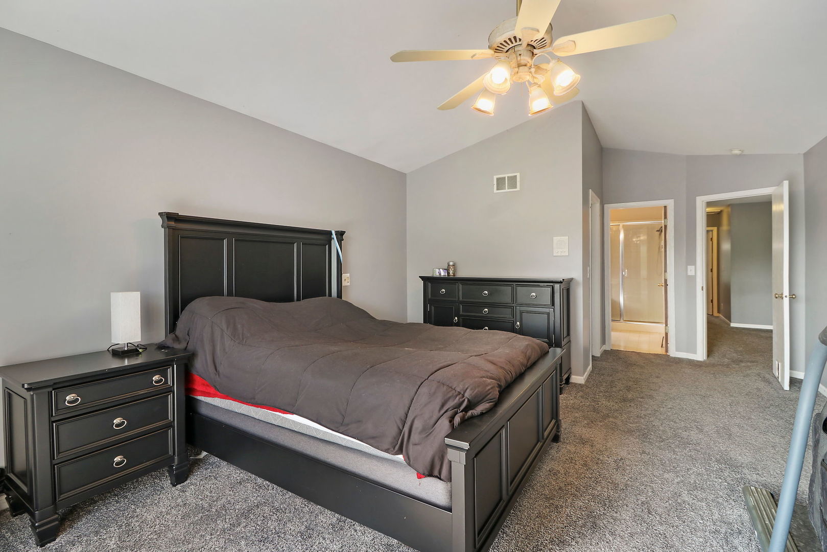 39 Rushmore Road Fox Lake, IL 60020 - Photo 20 of 38 a bedroom with a bed and a chandelier