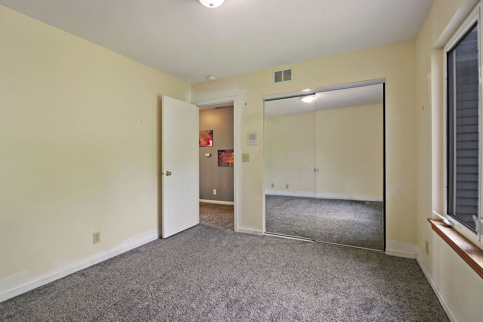 39 Rushmore Road Fox Lake, IL 60020 - Photo 25 of 38 an empty room with windows and entrance to other room