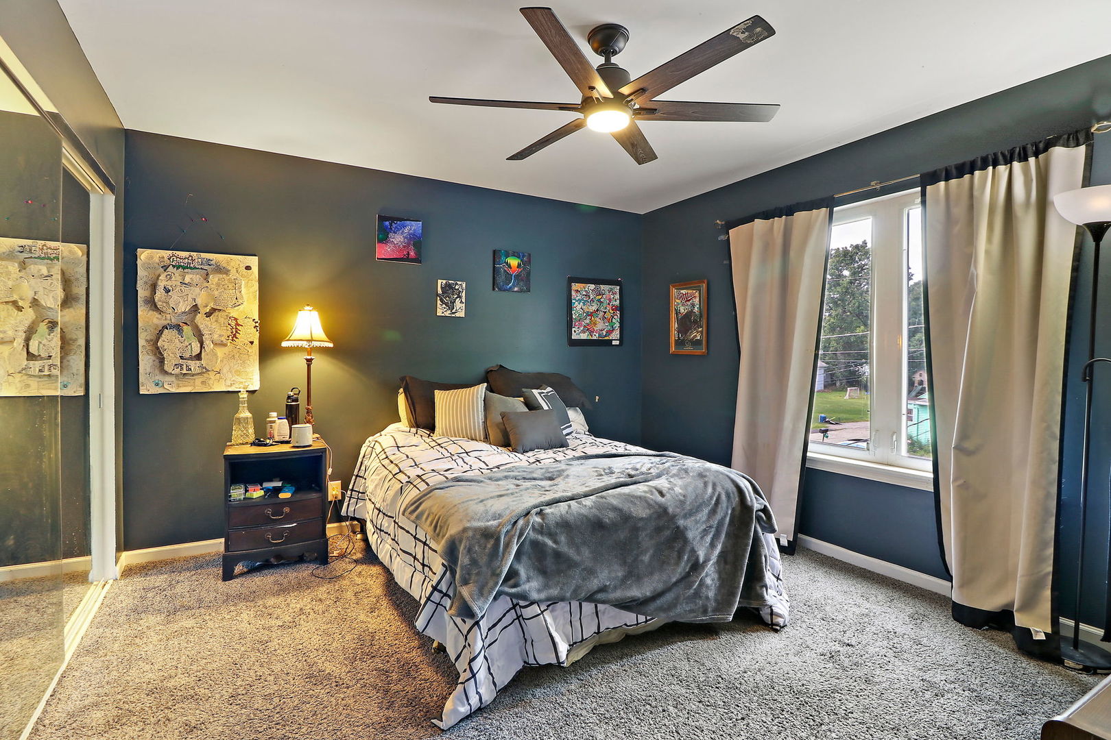 39 Rushmore Road Fox Lake, IL 60020 - Photo 27 of 38 a bedroom with a bed and a chandelier