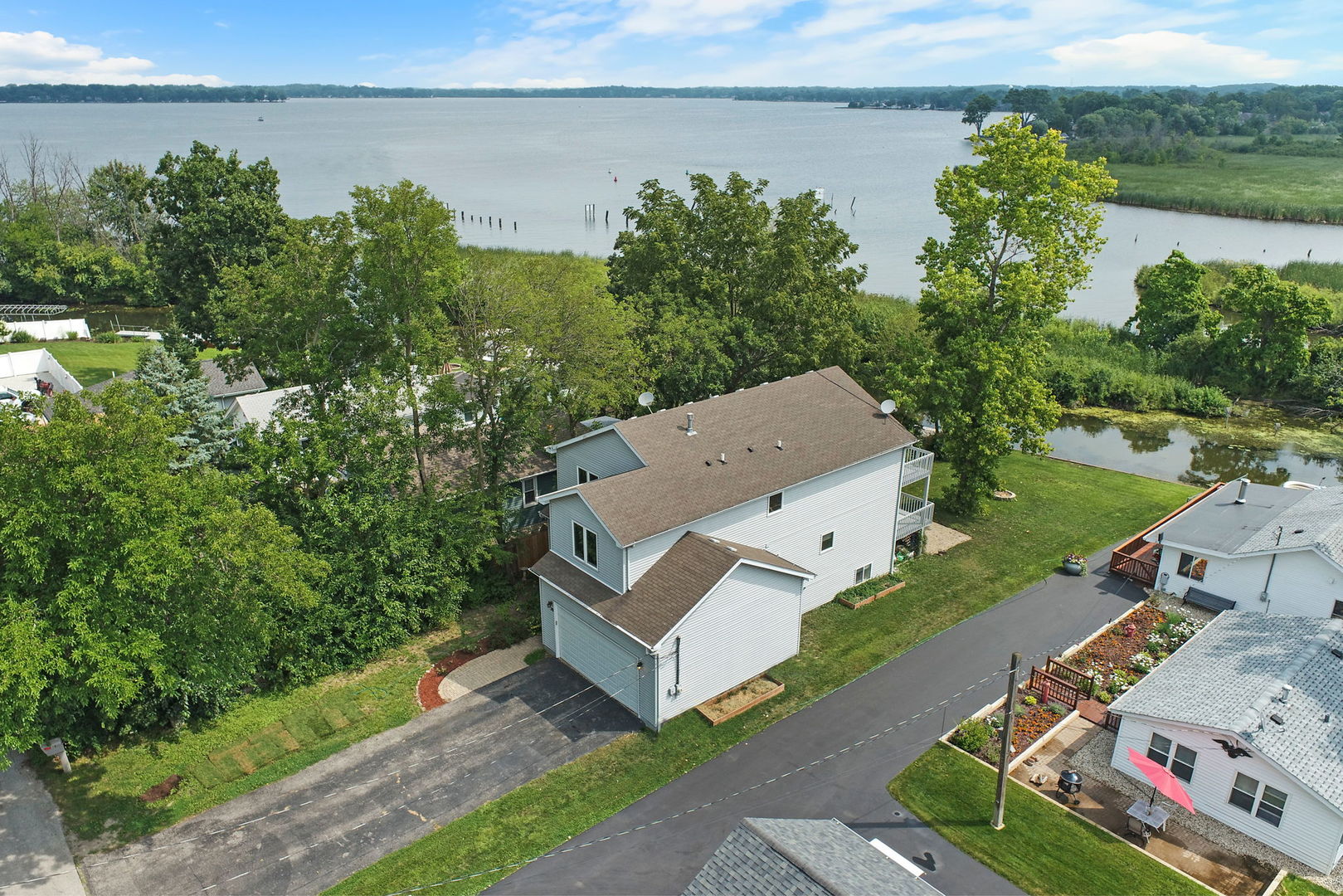 39 Rushmore Road Fox Lake, IL 60020 - Photo 3 of 38 an aerial view of a house with outdoor space and lake view