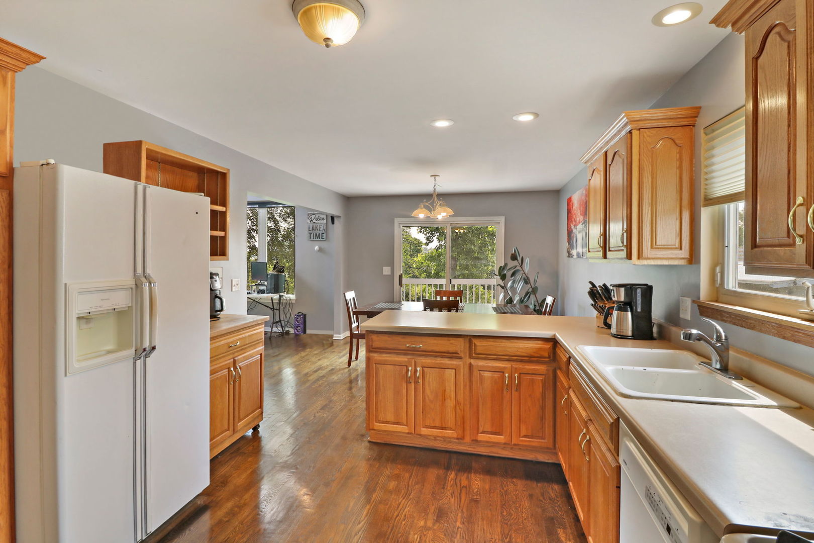 39 Rushmore Road Fox Lake, IL 60020 - Photo 8 of 38 a kitchen with stainless steel appliances granite countertop a refrigerator a sink dishwasher a stove and white countertops with wooden floor