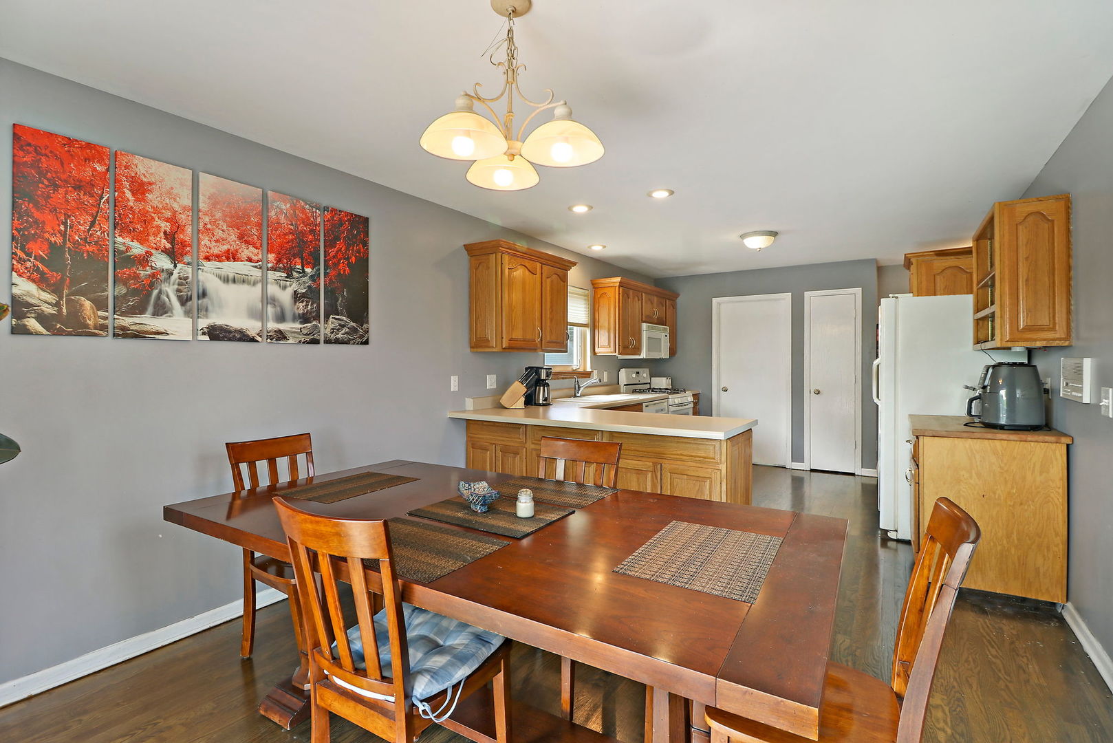 39 Rushmore Road Fox Lake, IL 60020 - Photo 10 of 38 a view of a dining room with furniture a chandelier and wooden floor