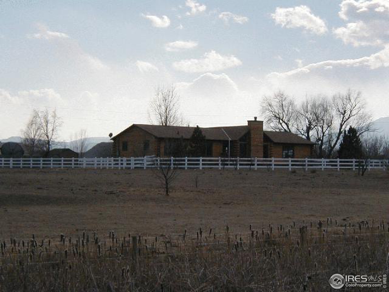 5150 St Vrain Road Longmont, CO 80503 - Photo 3 of 11 a view of house with river and outdoor space