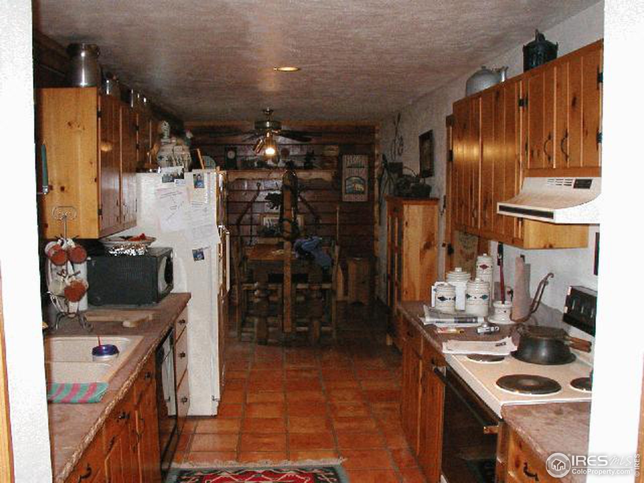 5150 St Vrain Road Longmont, CO 80503 - Photo 7 of 11 a kitchen with refrigerator and cabinets