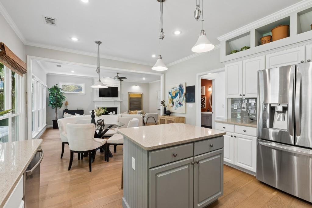 2120 Traywick Chase Alpharetta, GA 30004 - Photo 12 of 54 a kitchen with a dining table chairs refrigerator and cabinets
