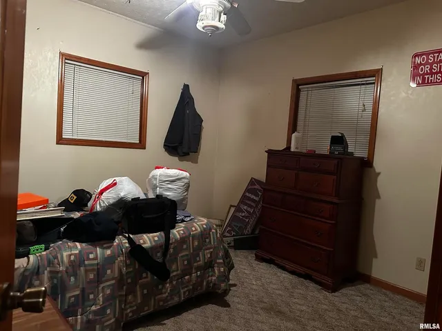 a living room with furniture and a mirror