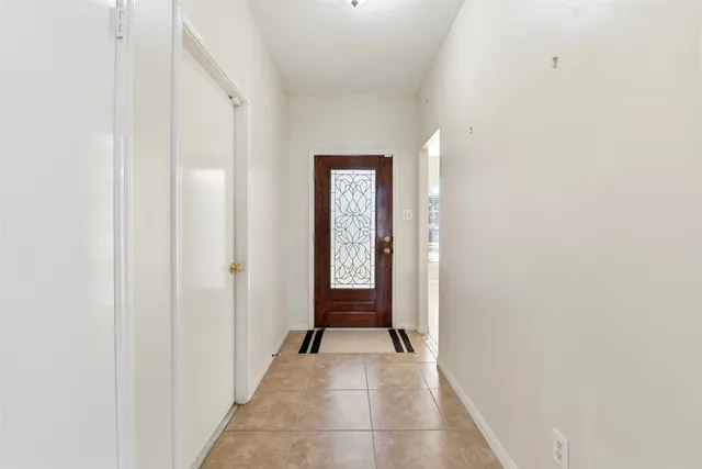 a view of a hallway with front door
