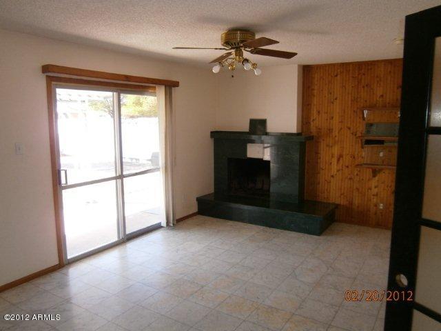3101 West Redfield Road Phoenix, AZ 85053 - Photo 5 of 13 FAMILY ROOM W/ FIREPLACE
