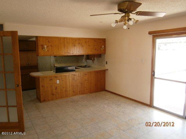 3101 West Redfield Road Phoenix, AZ 85053 - Photo 6 of 13 FAMILY ROOM AND KITCHEN