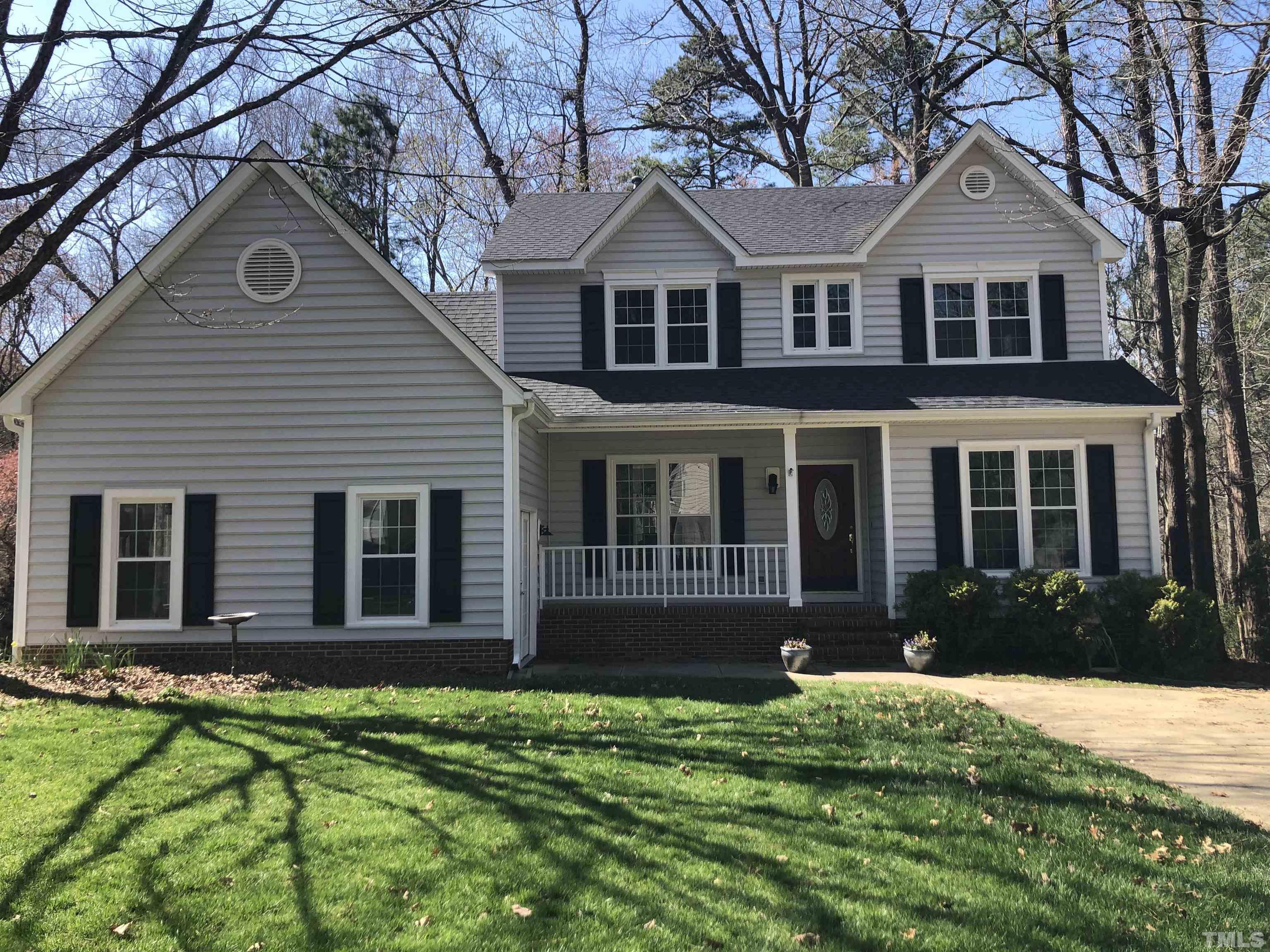 5516 Bridford Place Raleigh, NC 27613 - Photo 1 of 20 a front view of a house with a yard