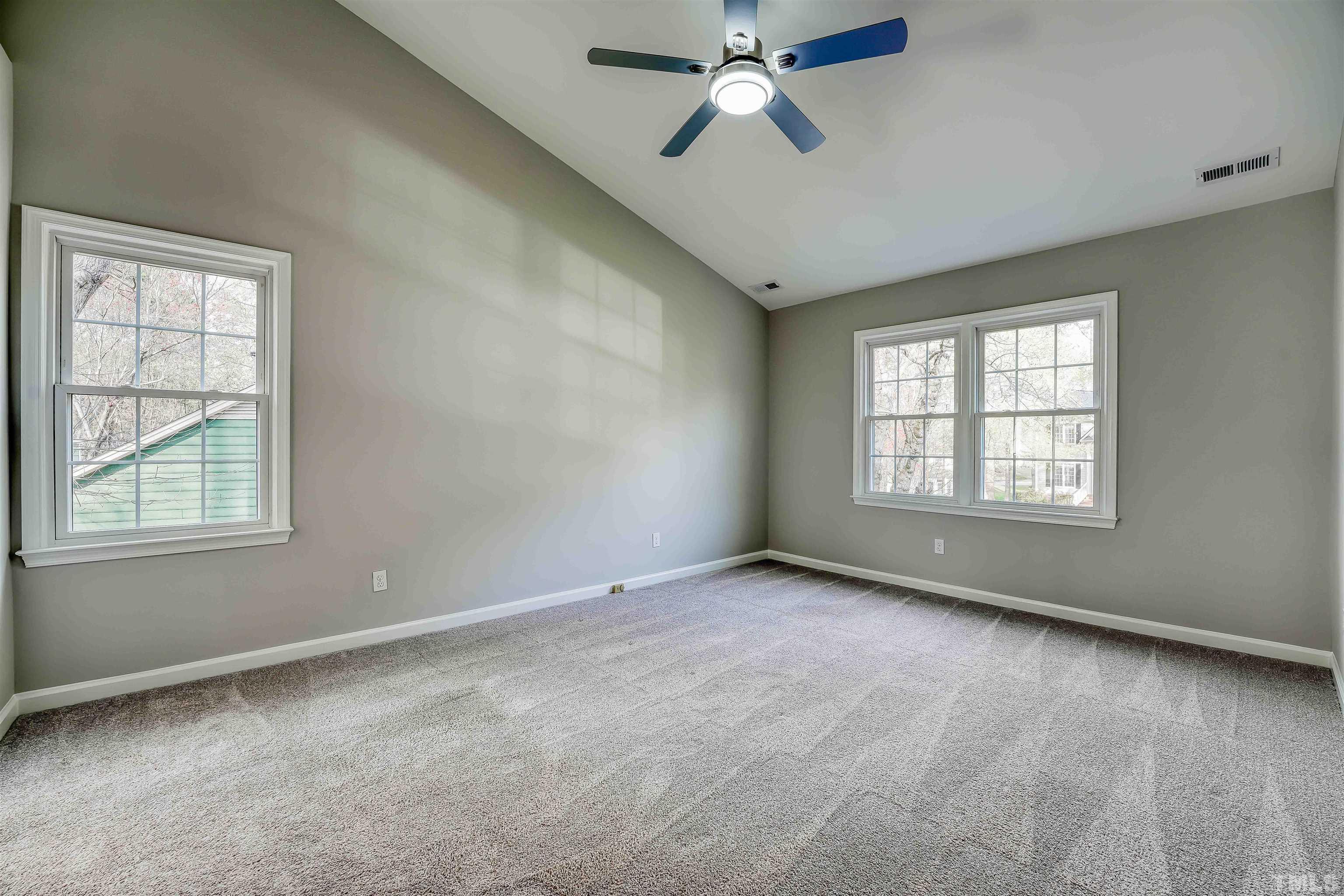 5516 Bridford Place Raleigh, NC 27613 - Photo 13 of 20 a view of an empty room with a window