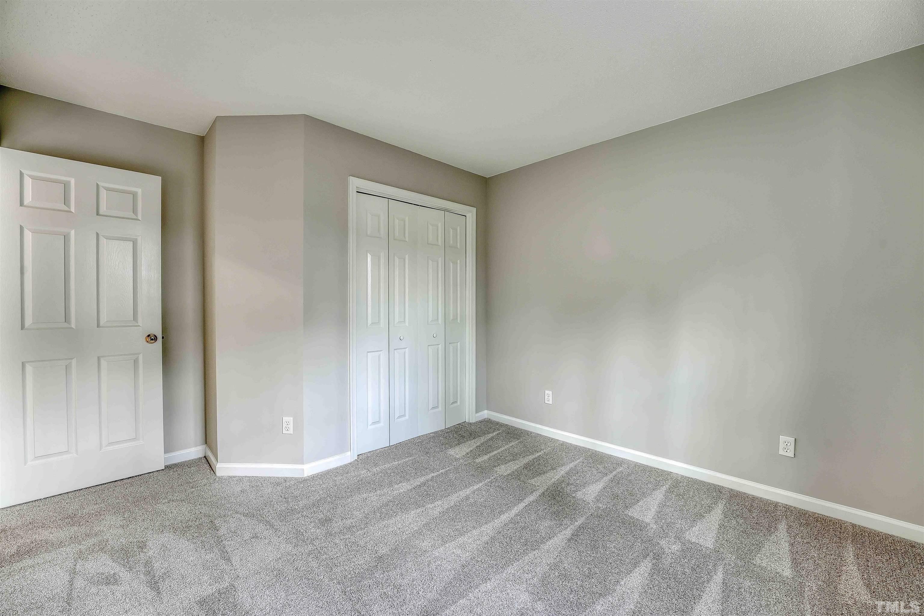 5516 Bridford Place Raleigh, NC 27613 - Photo 16 of 20 a view of an empty room and window