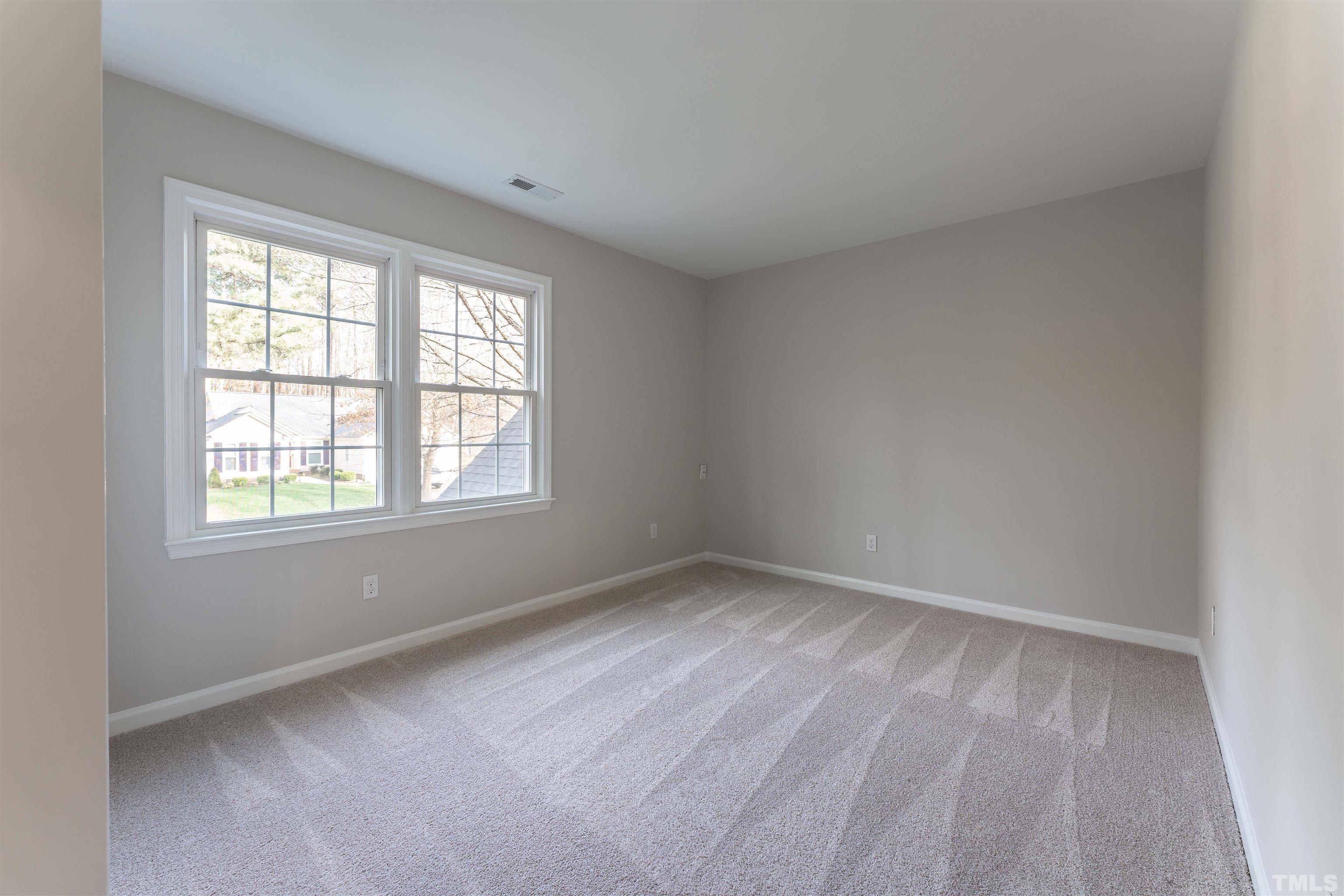 5516 Bridford Place Raleigh, NC 27613 - Photo 18 of 20 an empty room with a window