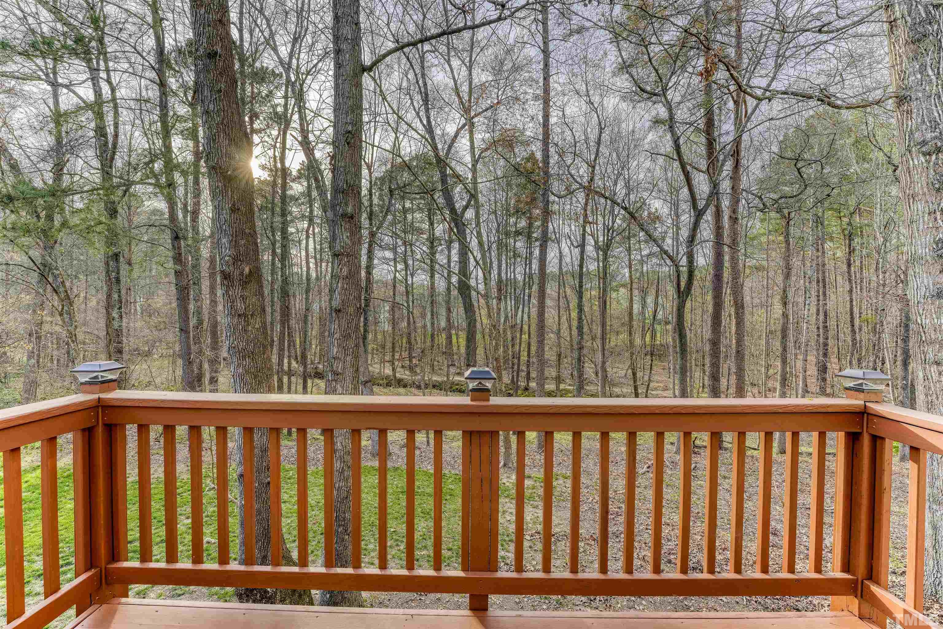 5516 Bridford Place Raleigh, NC 27613 - Photo 19 of 20 a balcony with wooden fence