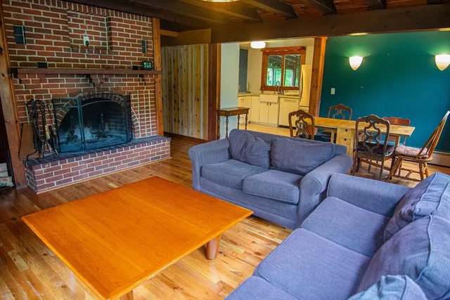 a room with two windows and wooden floor