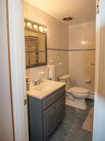a bathroom with a toilet and shower