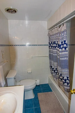 a bedroom with a large bed and a large window