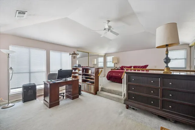 a view of a workspace with furniture