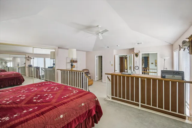 a bed room with a bed and a large window