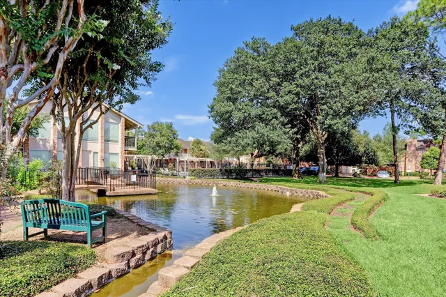a swimming pool with outdoor seating and yard