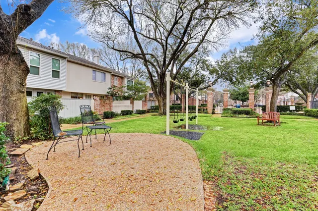 a view of a house with a yard porch and sitting area