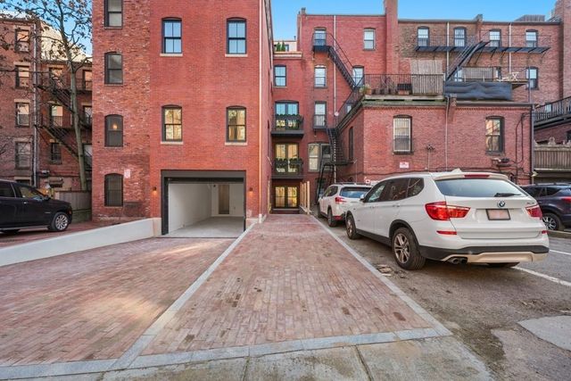 a car parked in front of a building