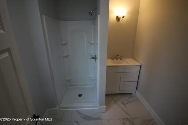 a bathroom with a sink and mirror