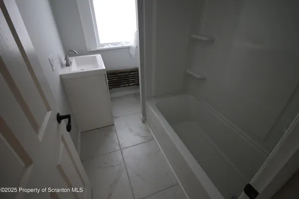 a bathroom with a bathtub