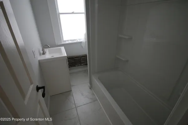 a bathroom with a bathtub