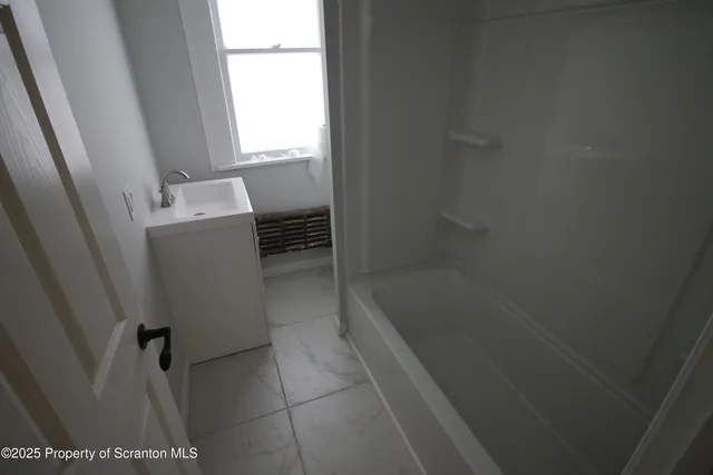 a bathroom with a bathtub