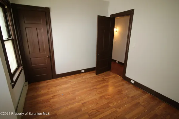 an empty room with mirror