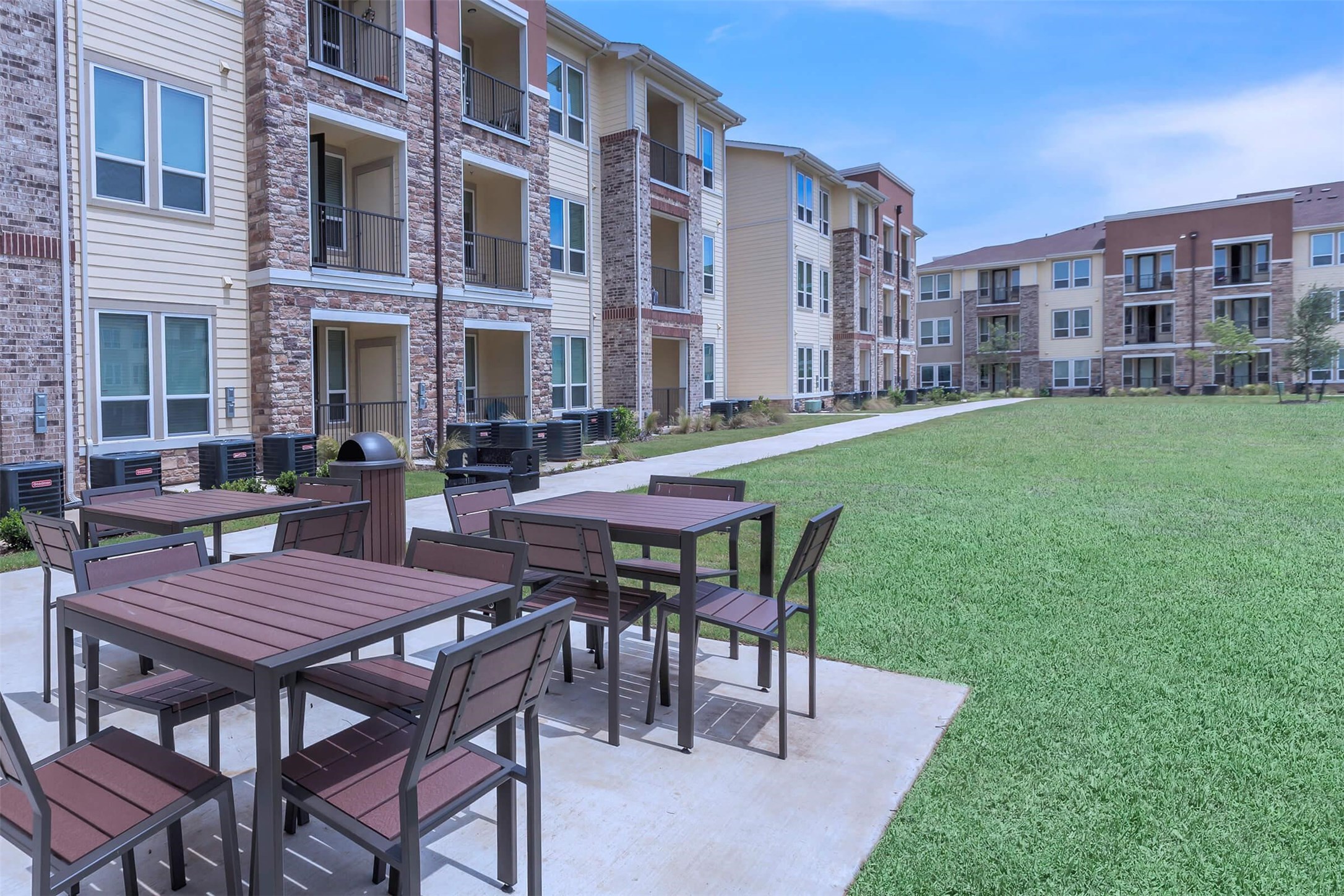 2401 Golden Heights Road, Unit 160 Fort Worth, TX 76177 - Photo 2 of 6 a table and chairs in front of a brick building