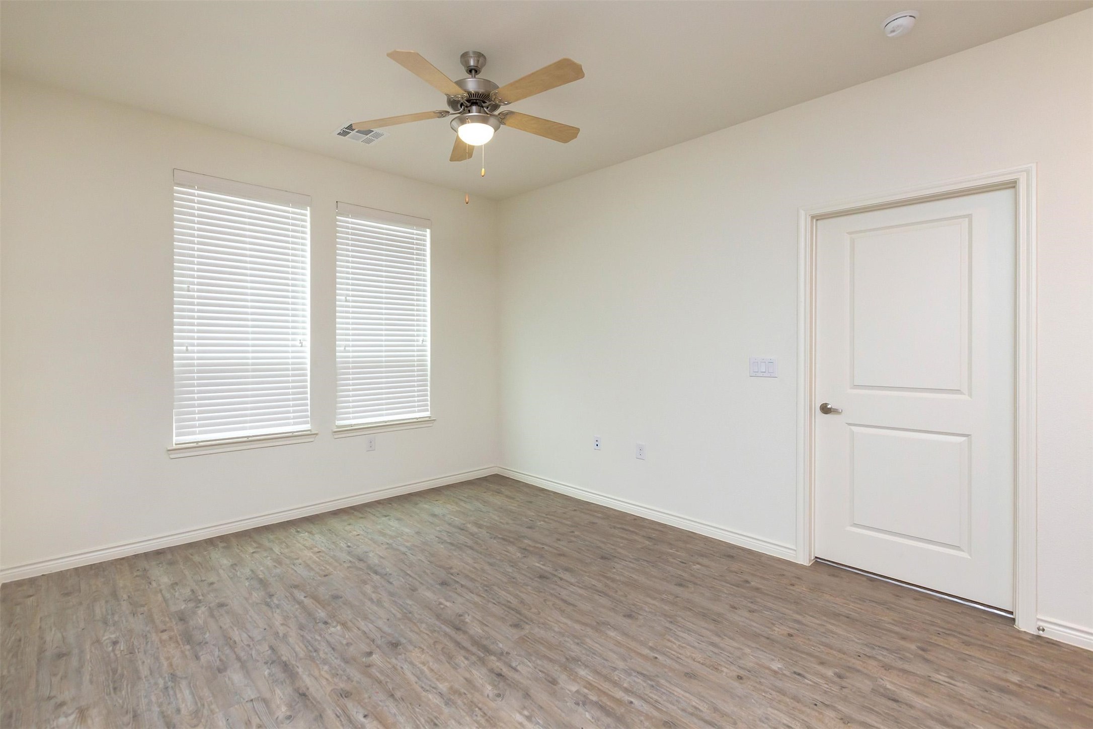 2401 Golden Heights Road, Unit 160 Fort Worth, TX 76177 - Photo 4 of 6 an empty room with wooden floor and window