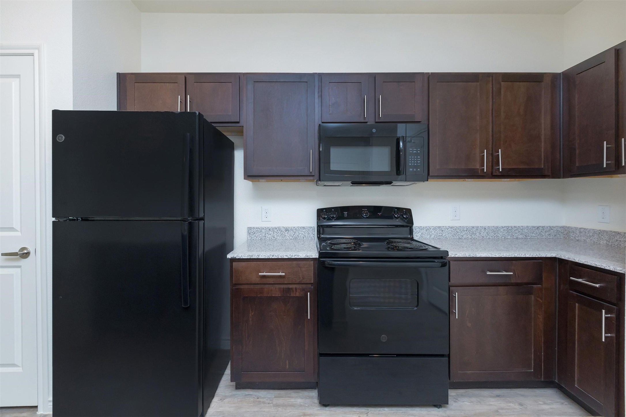 2401 Golden Heights Road, Unit 160 Fort Worth, TX 76177 - Photo 6 of 6 a kitchen with a refrigerator stove and microwave