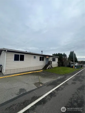 a house view with a backyard space