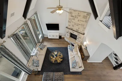 a view of living room with furniture and a fireplace