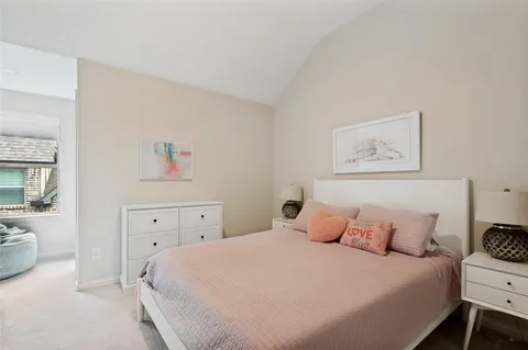 a bedroom with a bed and a cabinets