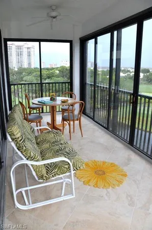 a view of a swimming pool with a lounge chair