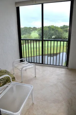 a view of balcony with furniture