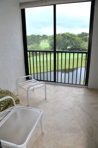 a view of balcony with furniture