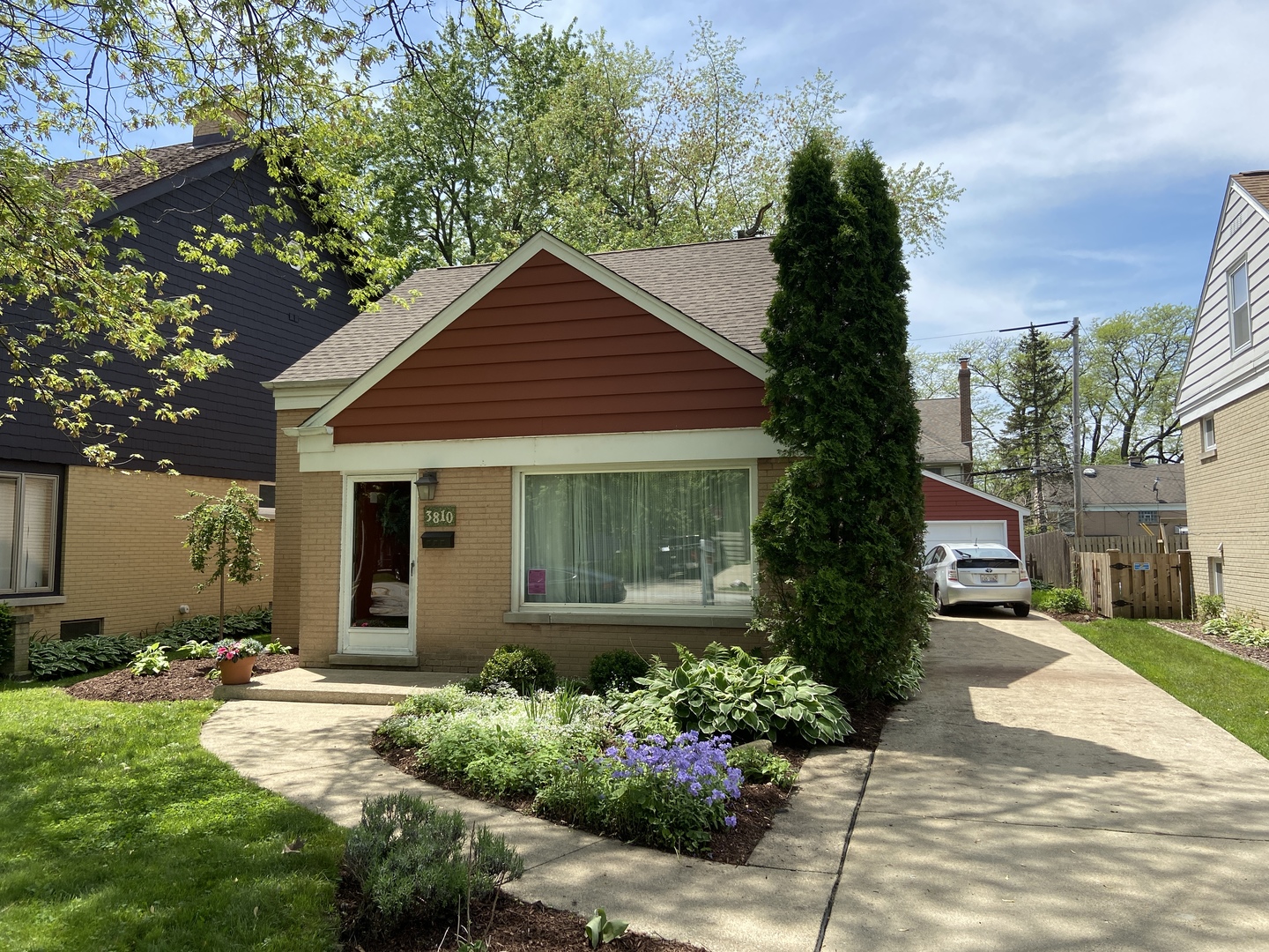 3810 Wolf Road Western Springs, IL 60558 - Photo 1 of 35 a front view of a house with a garden