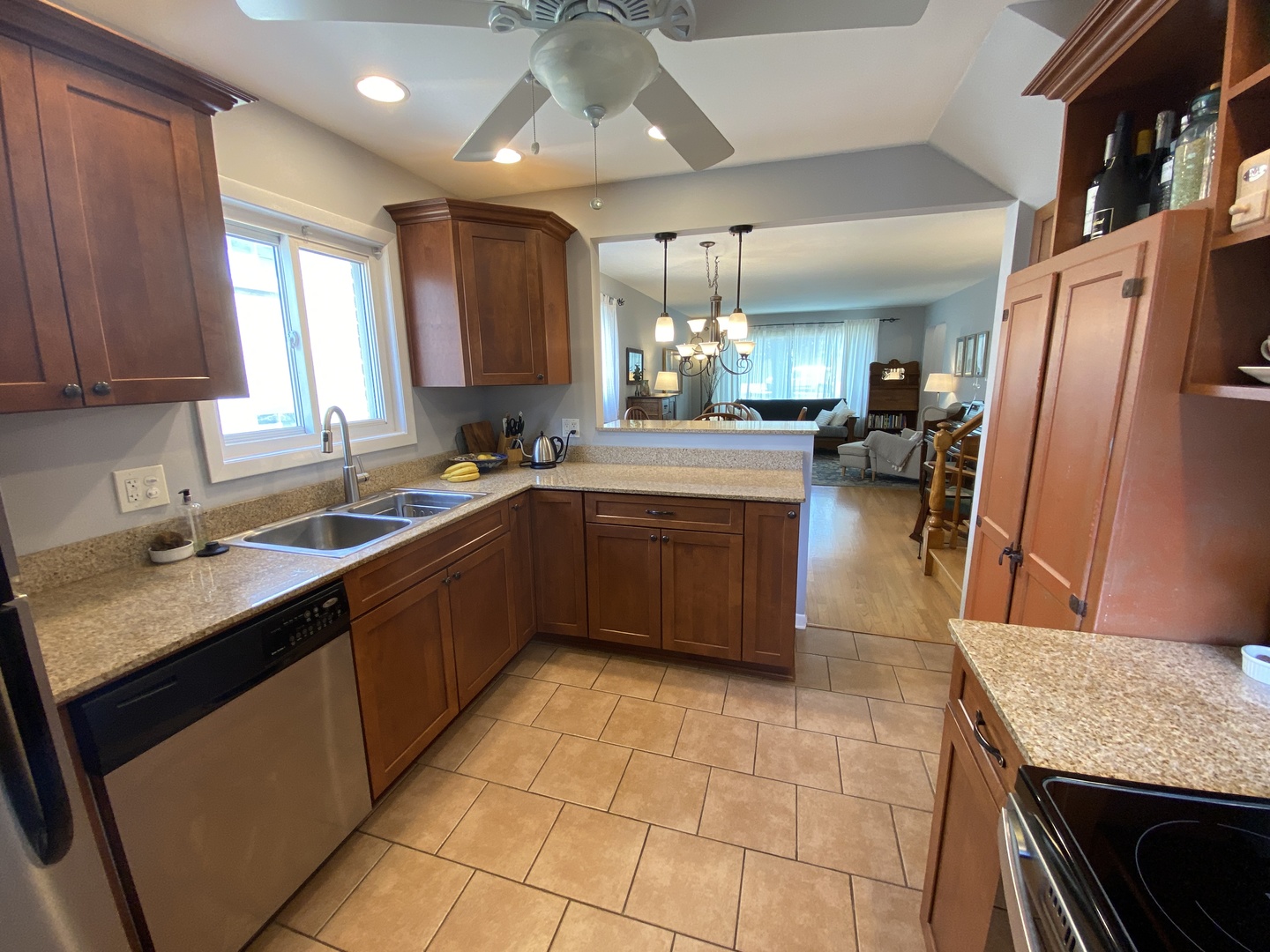 3810 Wolf Road Western Springs, IL 60558 - Photo 11 of 35 a kitchen with stainless steel appliances granite countertop a sink stove and cabinets