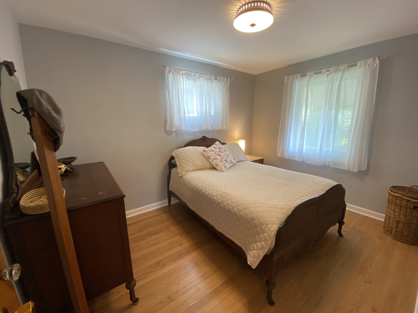 3810 Wolf Road Western Springs, IL 60558 - Photo 13 of 35 a bedroom with a bed and two windows