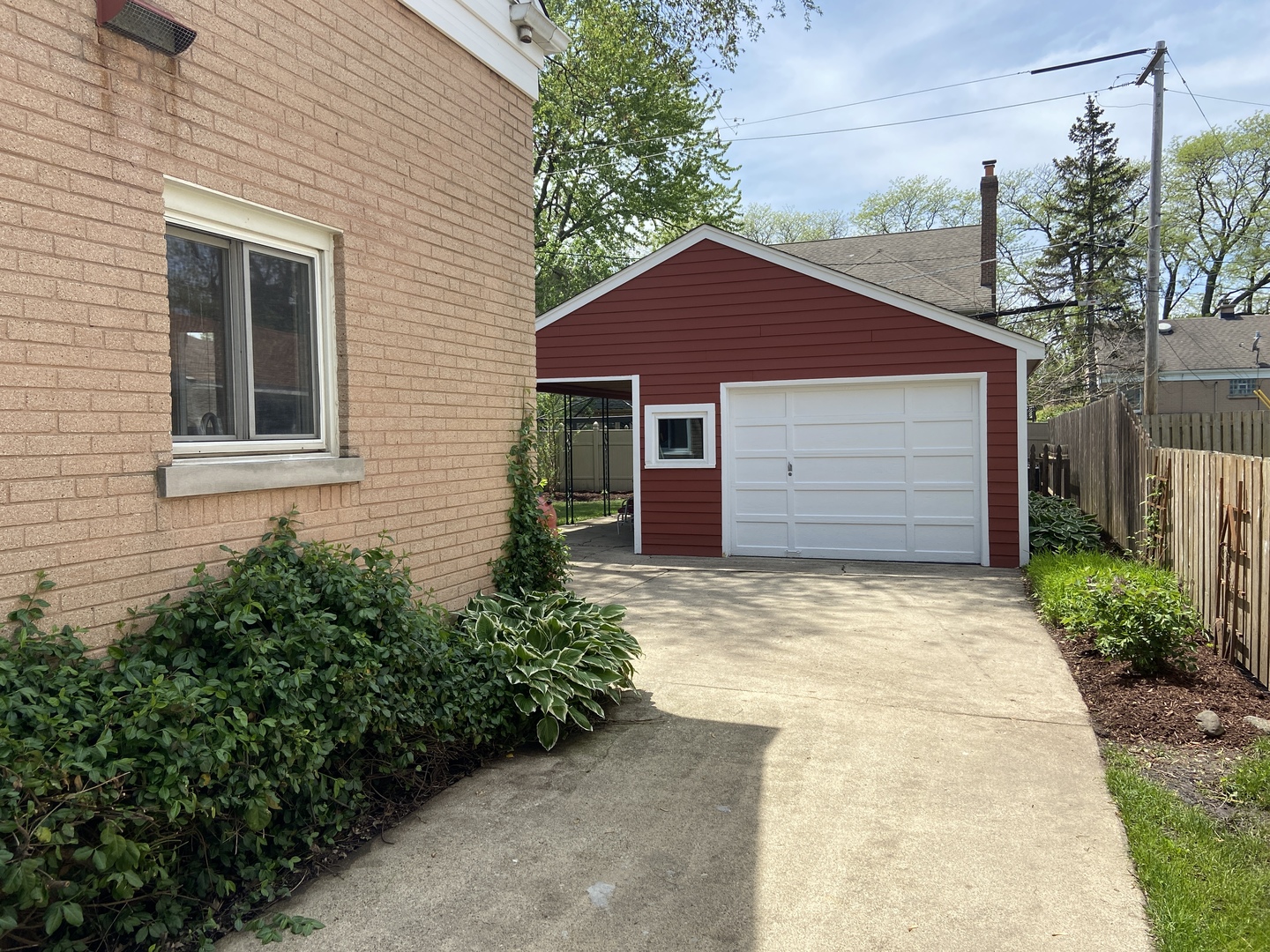 3810 Wolf Road Western Springs, IL 60558 - Photo 28 of 35 a front view of a house with a yard and garage
