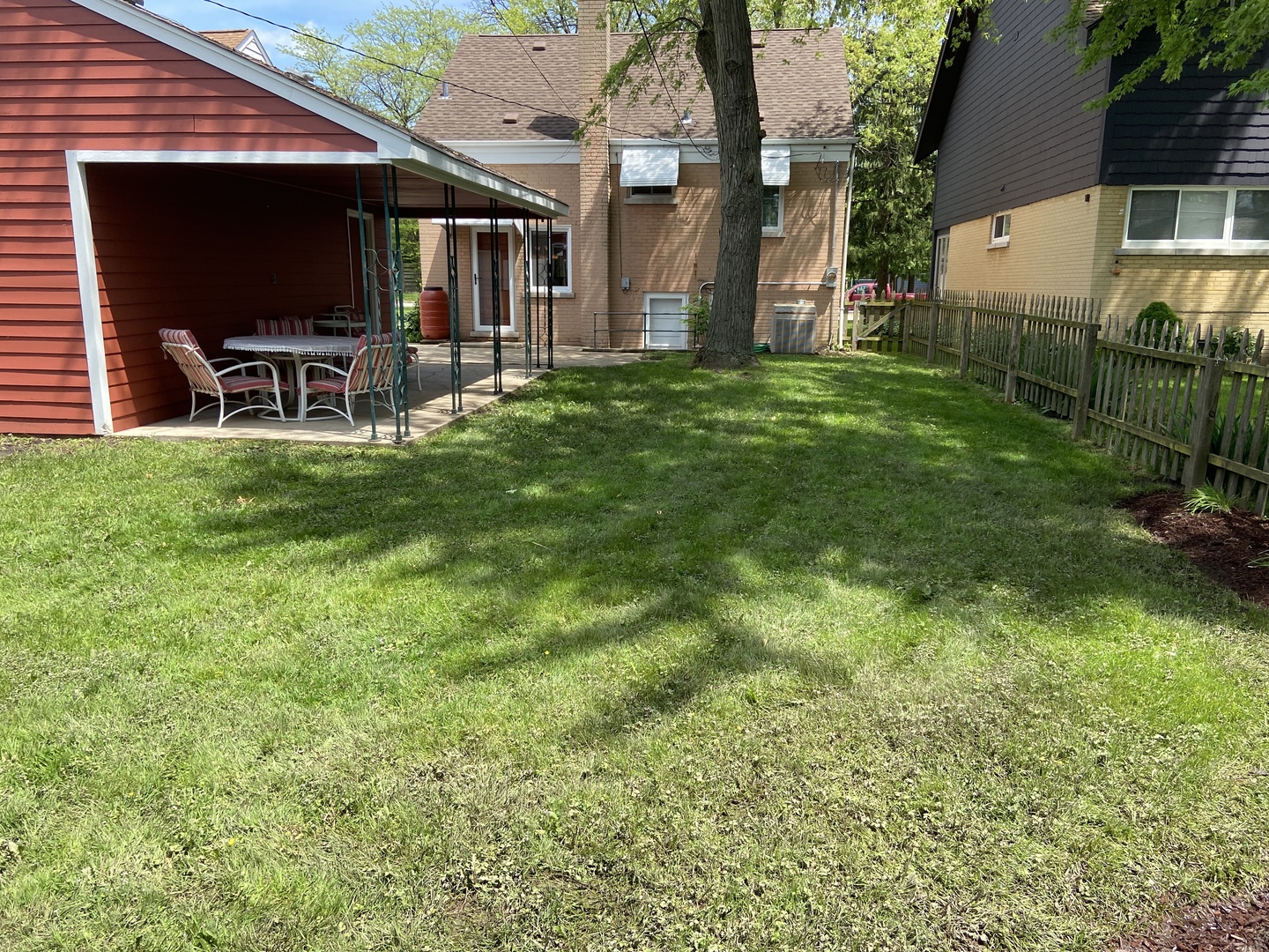 3810 Wolf Road Western Springs, IL 60558 - Photo 35 of 35 a view of a backyard with table and chairs and potted plants