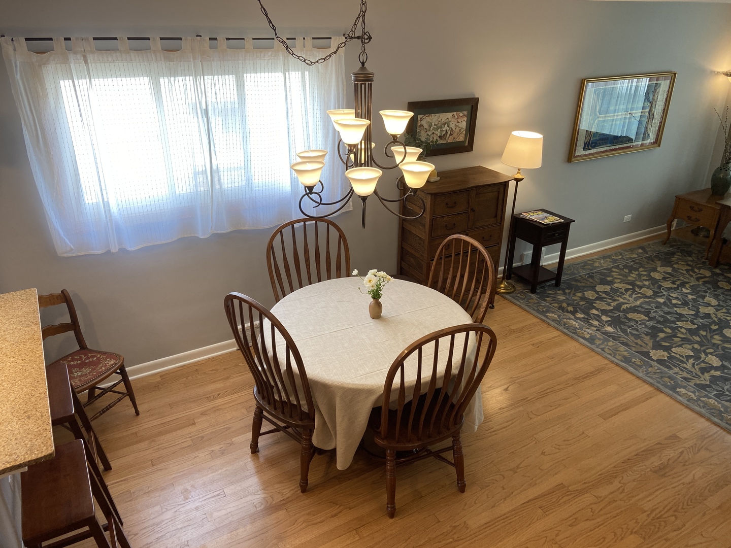 3810 Wolf Road Western Springs, IL 60558 - Photo 5 of 35 a dining room with furniture a chandelier and wooden floor