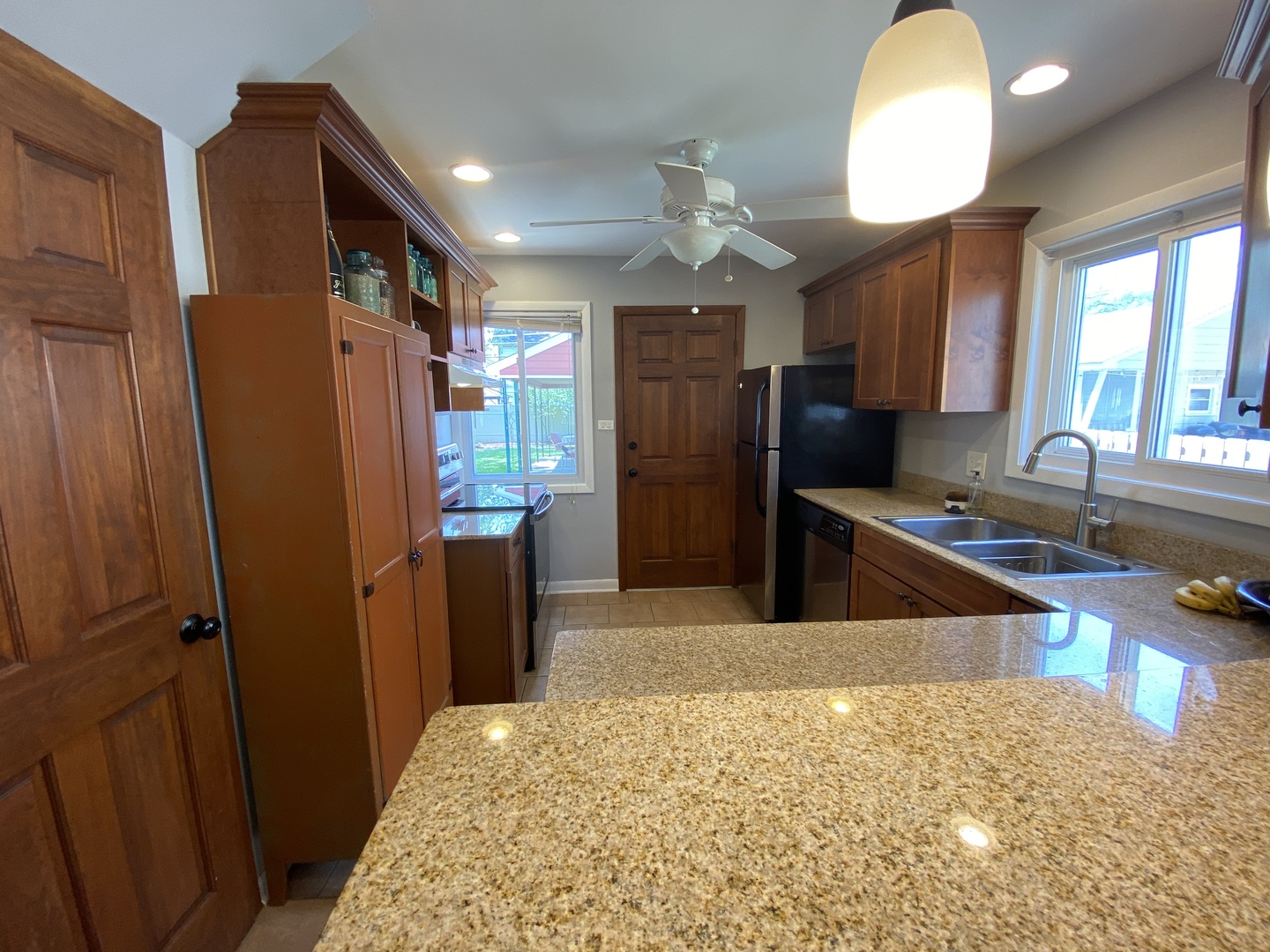 3810 Wolf Road Western Springs, IL 60558 - Photo 8 of 35 a kitchen with stainless steel appliances granite countertop a refrigerator and a sink