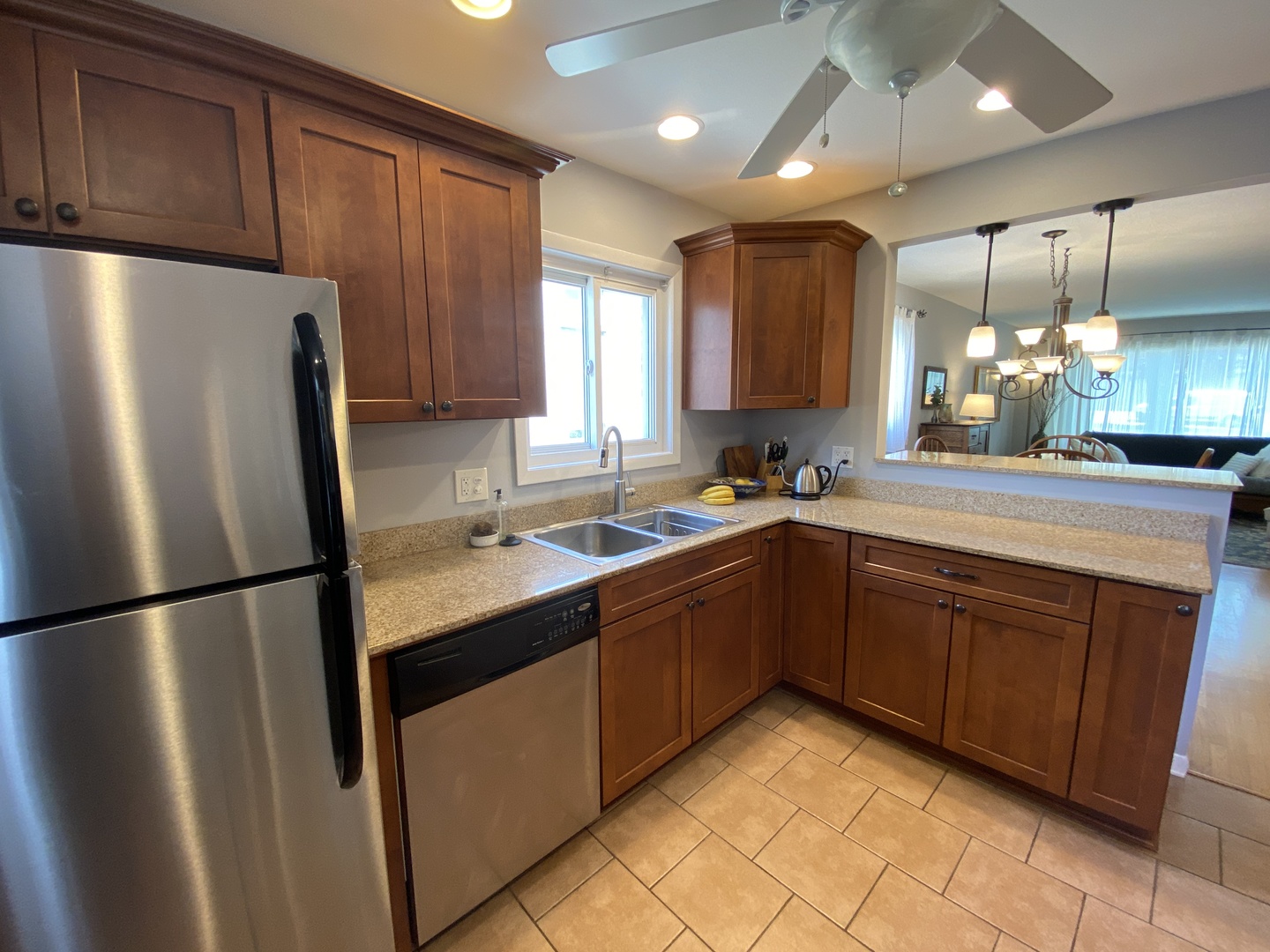 3810 Wolf Road Western Springs, IL 60558 - Photo 10 of 35 a kitchen with stainless steel appliances granite countertop a refrigerator sink and cabinets
