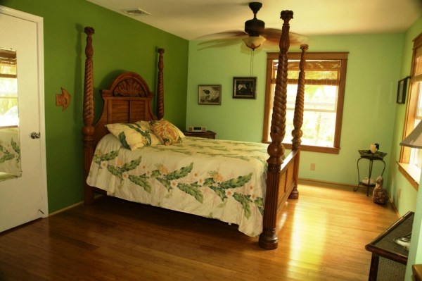 6701 Puupilo Road, Unit A Kapaa, HI 96746 - Photo 5 of 7 a bedroom with a bed and wooden floor